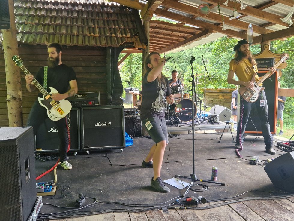 Rock band playing an outdoor set at Bear Stone Festival